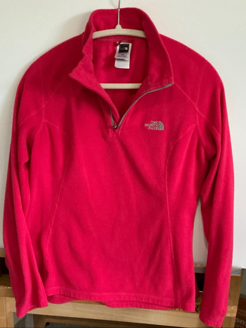 The North Face Women’s Quarter-Zip Fleece pullover in red.